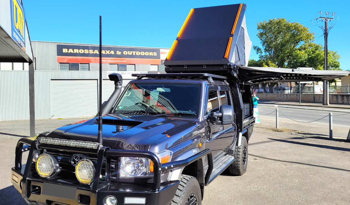 79 series Toyota Landcruiser decked out with Boss Aluminum tray canopy awning and rooftop tent, all Australian made